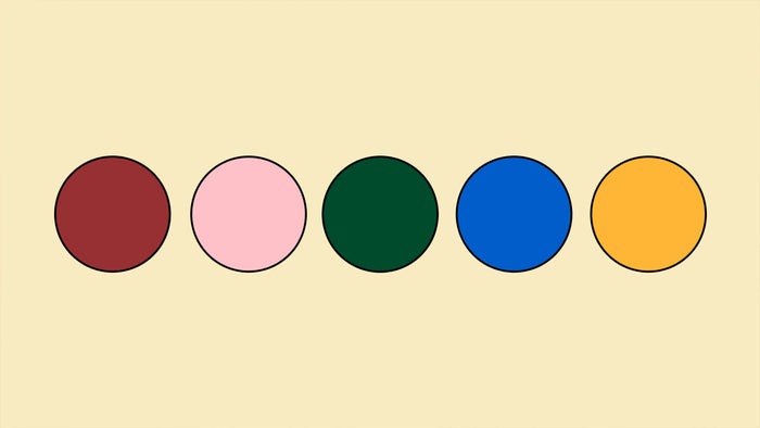 Five colored dots on a cream background.