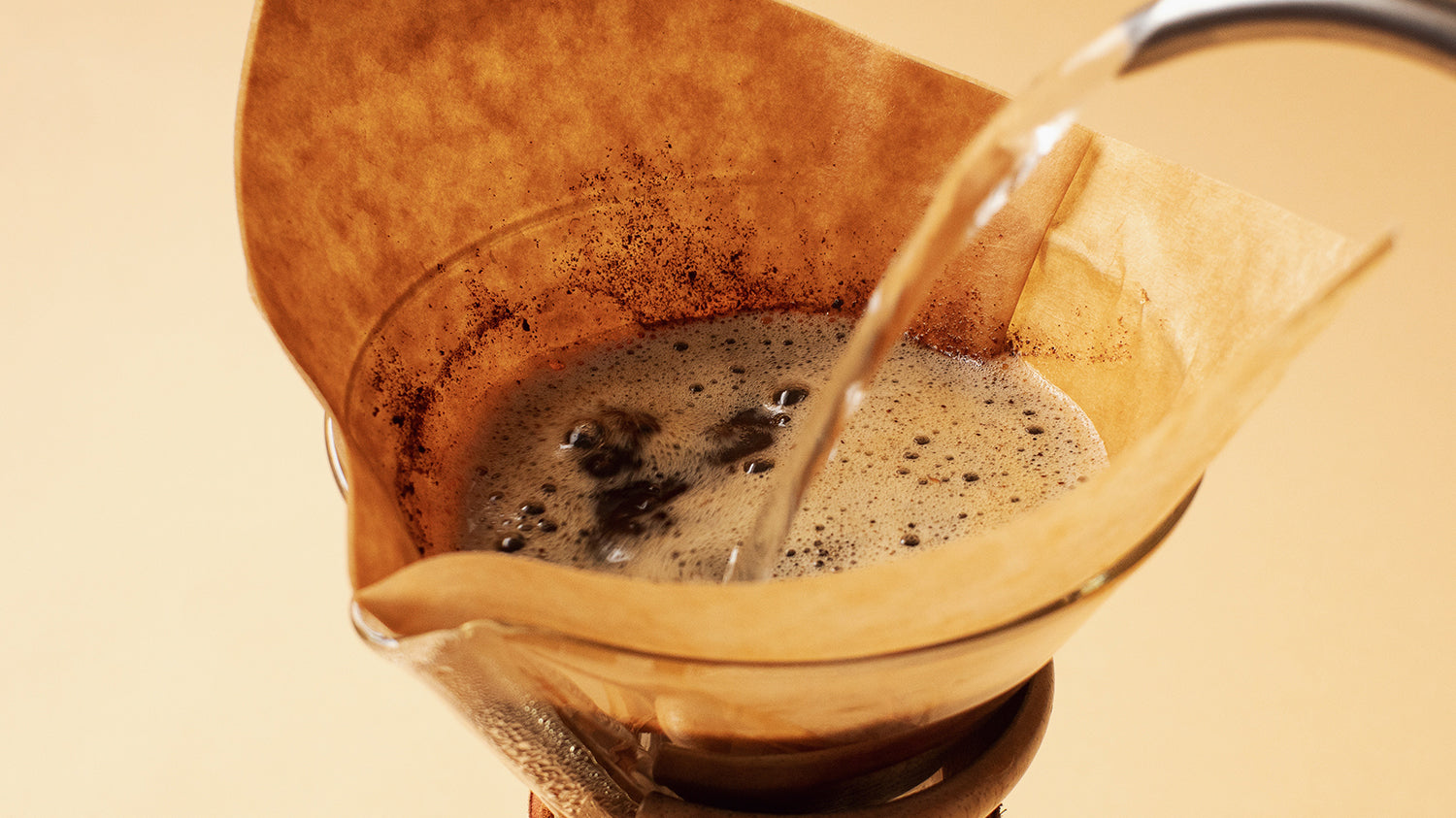 Saturating coffee grounds in a Chemex filter.