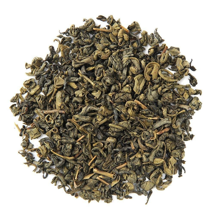 Organic Pinhead Gunpowder green tea leaves, tightly rolled pellets offering a bold and smoky flavor profile.