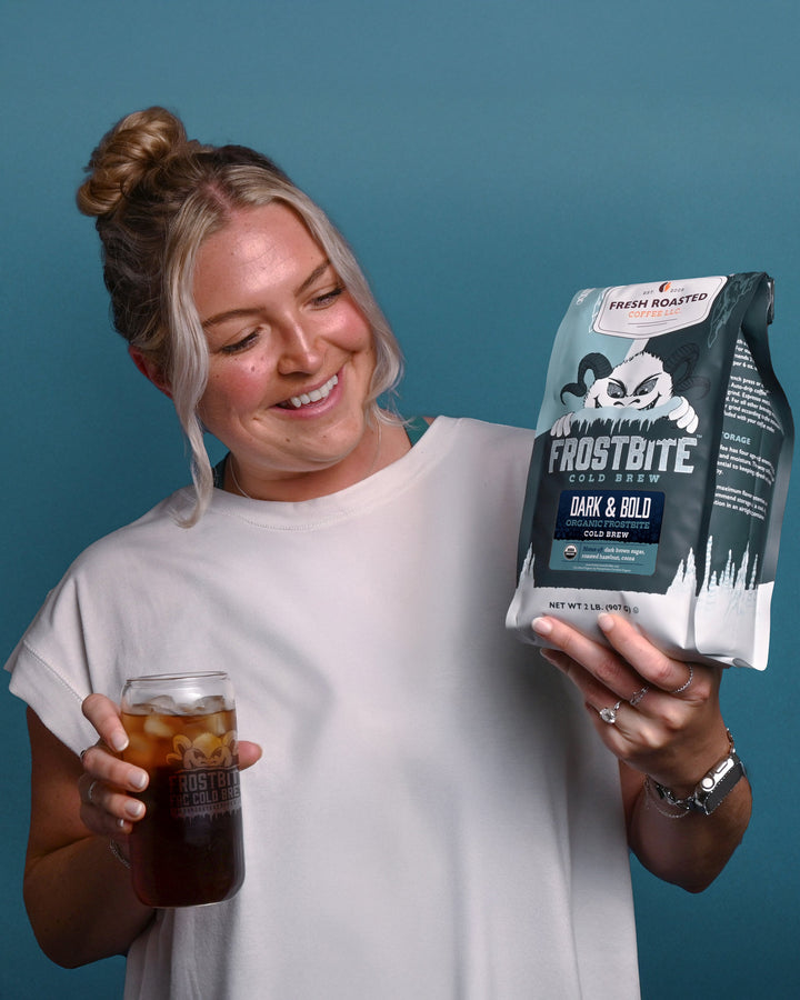 Fresh Roasted Coffee Dark & Bold Organic Frostbite Cold Brew, 2lb bag held alongside a freshly brewed glass over ice.
